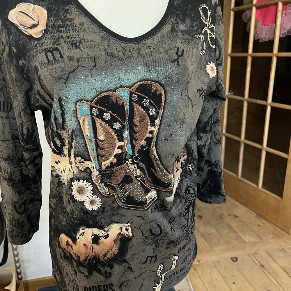 Brand New with tags cowgirl rhinestone t shirt. Size large 3/4 length sleeves.